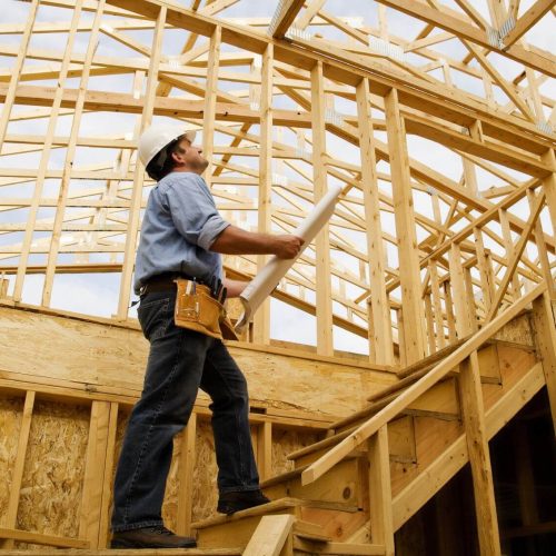 men standing in wood structure