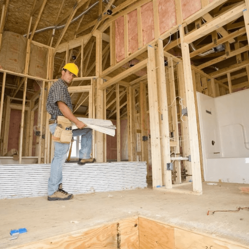 man standing in a under constructed building