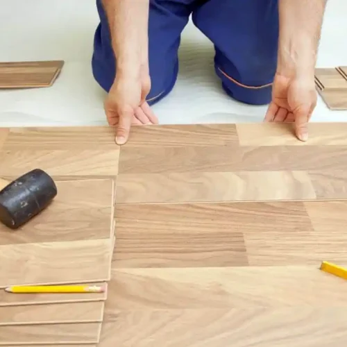 man attaching the sheet to floor