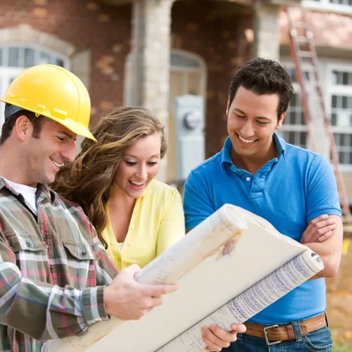 Builders constructing House in London