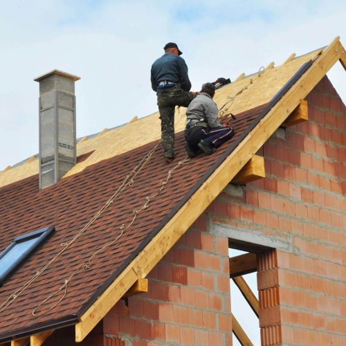 workers repairing the roof